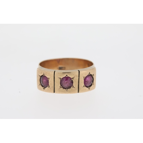 1002 - Vintage wide band ring set with three almandine garnets, market 9ct.