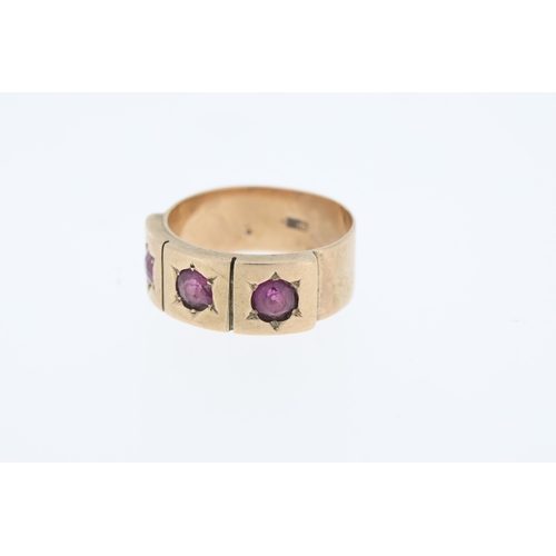 1002 - Vintage wide band ring set with three almandine garnets, market 9ct.