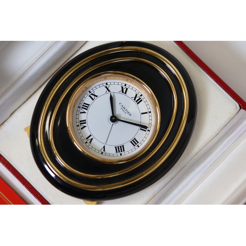 102 - Cartier mechanical desk/bedside alarm clock. Approx 83.5x99mm Comes with Cartier box and undated pap... 