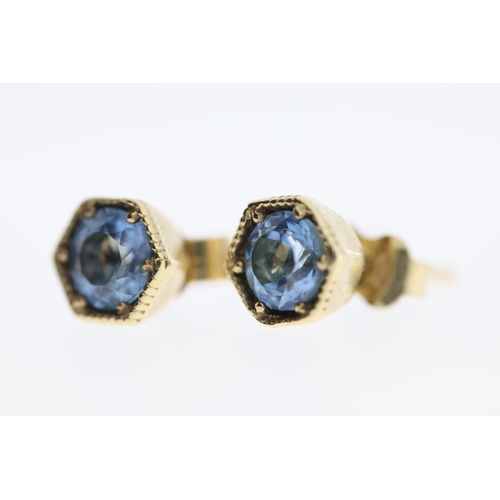 1005 - A pair of 9ct aquamarine stud earrings.