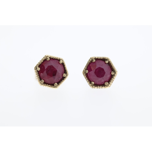 1006 - A pair of 9ct ruby stud earrings