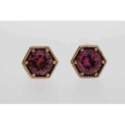 1007 - A pair of 9ct pink tourmaline stud earrings.