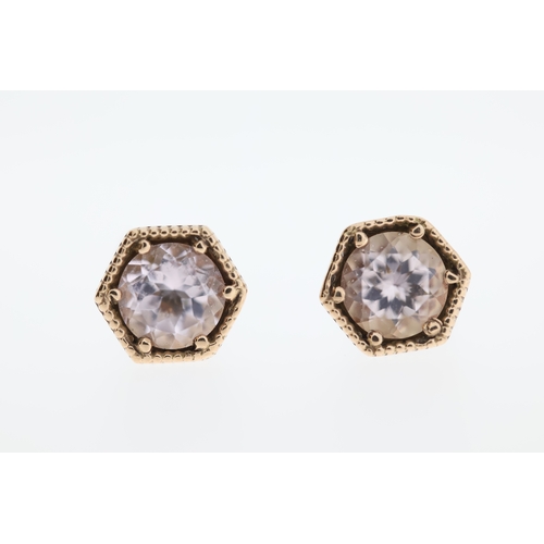 1008 - A pair of 9ct morganite stud earrings.