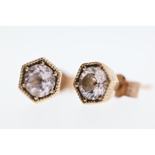 1008 - A pair of 9ct morganite stud earrings.