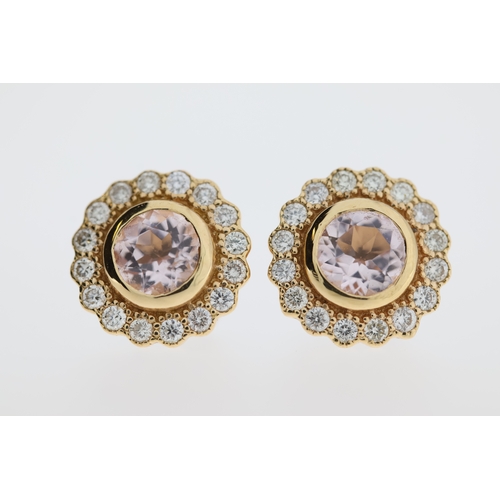 1009 - A pair of 18ct morganite & diamond stud earrings.