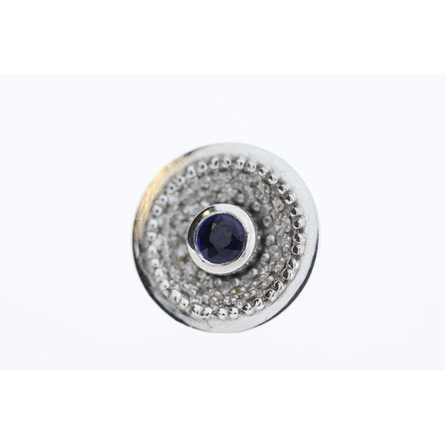 1010 - A pair of 18ct sapphire & diamond stud earrings.