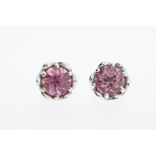 1013 - A pair of 9ct pink tourmaline stud earrings.