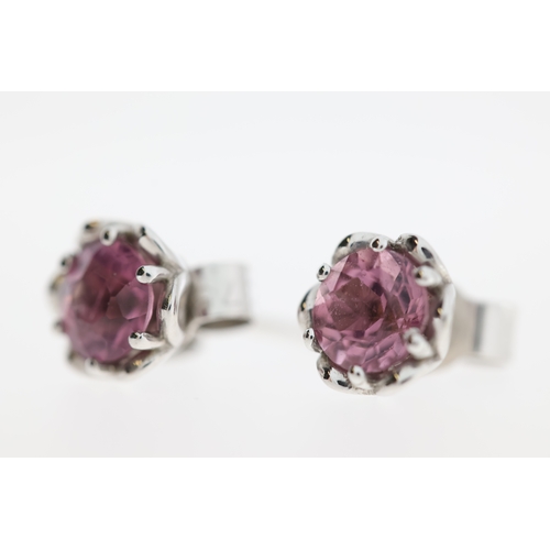 1013 - A pair of 9ct pink tourmaline stud earrings.