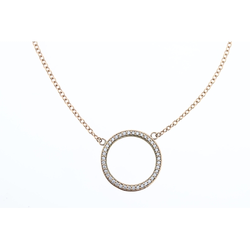 1016 - A 9ct diamond circle necklace.