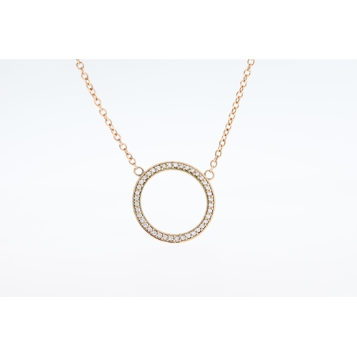 1016 - A 9ct diamond circle necklace.