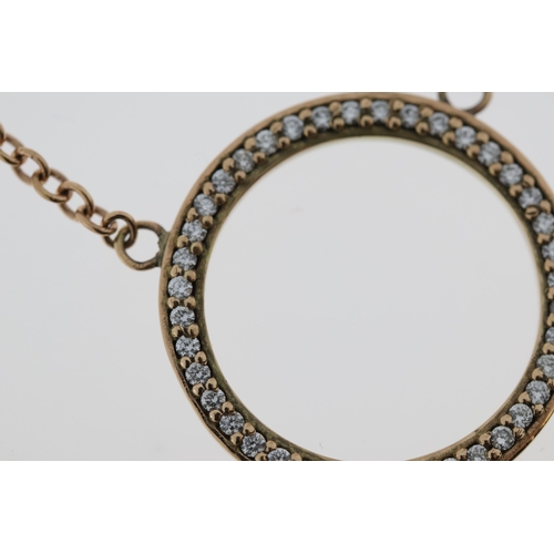 1016 - A 9ct diamond circle necklace.