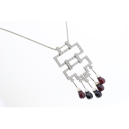 1017 - An 18ct diamond & garnet geometric necklace.