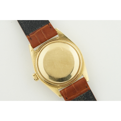 69 - ROLEX OYSTER PERPETUAL DAY-DATE 18CT GOLD REF. 1803 CIRCA 1973, circular champagne dial with stick h... 