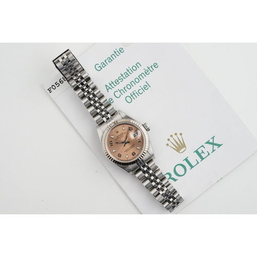 143 - ROLEX OYSTER PERPETUAL DATEJUST W/ GUARANTEE PAPERS REF. 79174 CIRCA 2003, circular salmon dial with... 