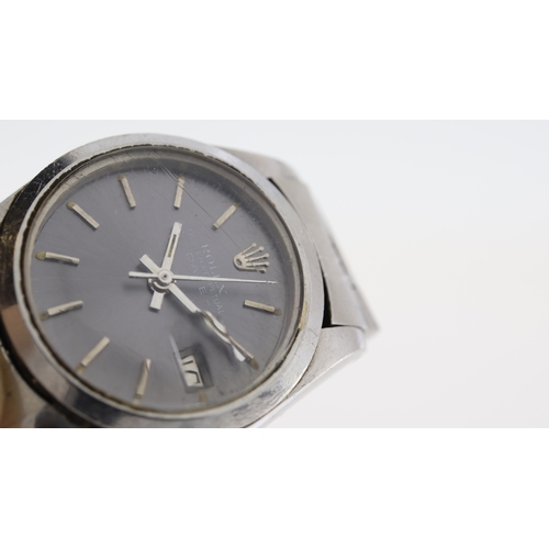 158 - Brand: Rolex
 Model Name: Oyster Perpetual Date 
 Reference: 6916
 Movement: Automatic
 Year: Circa ... 