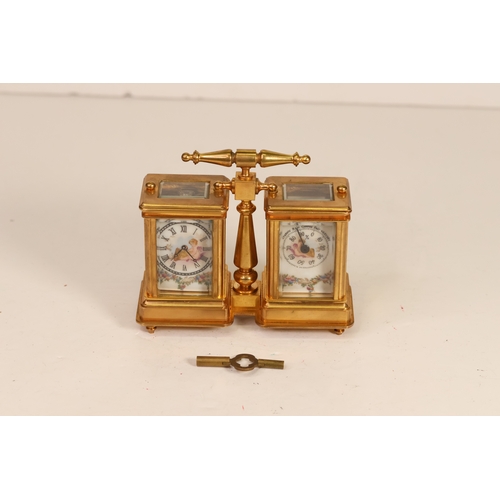 174 - A wonderfully decorated brass & porcelain double carriage clock with a barometre. Currently in full ... 