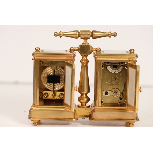 174 - A wonderfully decorated brass & porcelain double carriage clock with a barometre. Currently in full ... 