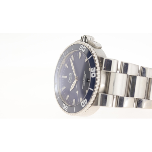 129 - Brand: Oris
 Model Name: Aquis 
 Reference: 7653
 Movement: Automatic
 Dial shape: Circular
 Dial co... 