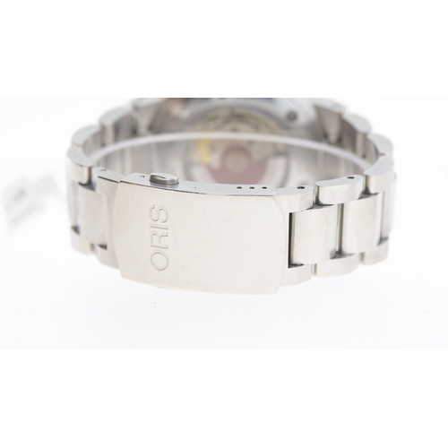 129 - Brand: Oris
 Model Name: Aquis 
 Reference: 7653
 Movement: Automatic
 Dial shape: Circular
 Dial co... 