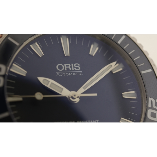 129 - Brand: Oris
 Model Name: Aquis 
 Reference: 7653
 Movement: Automatic
 Dial shape: Circular
 Dial co... 