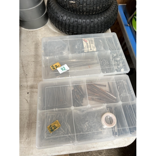 92 - x 2 plastic storage boxes + contents