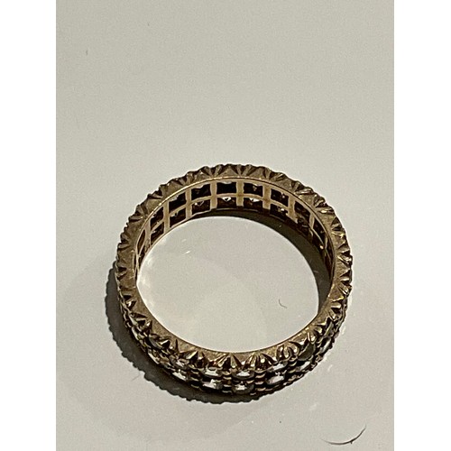 104 - 9ct gold ring , band ring with multiple stones all the way around 3 grams