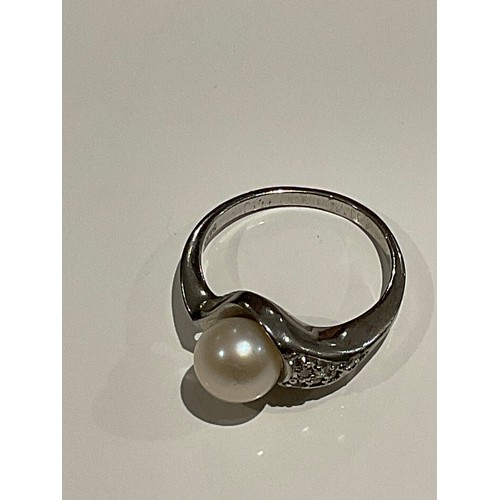 108 - silver stamped 925 ring with Pearl with clear stones on one shoulder 3.2 grams