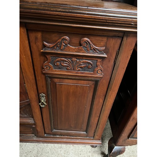 213 - ornate mirror back sideboard with carved panels to doors