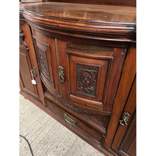 213 - ornate mirror back sideboard with carved panels to doors