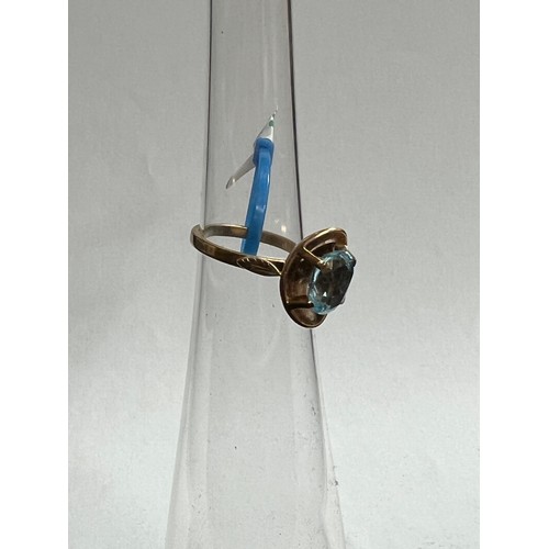 292 - 9ct gold ring with blue topaz stone 4.9 grams