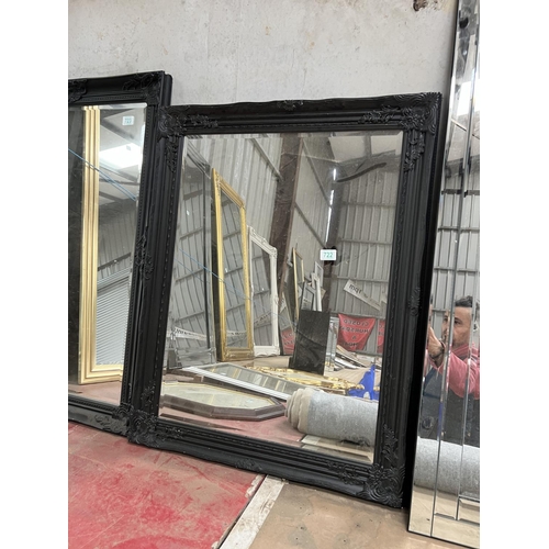 722 - black framed mirror