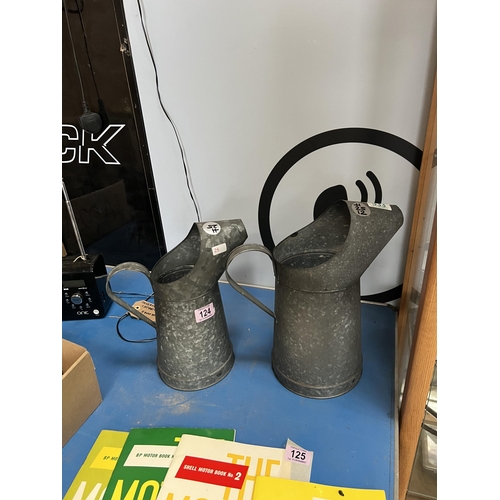 124 - 2 x oil jugs h25