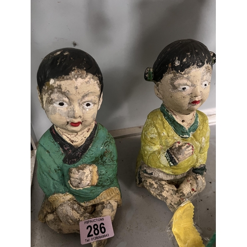 286 - Pair oriental concrete figures