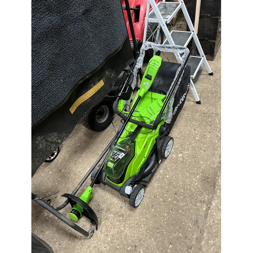 388 - Greenworks cordless mower and strimmer with battery / charger