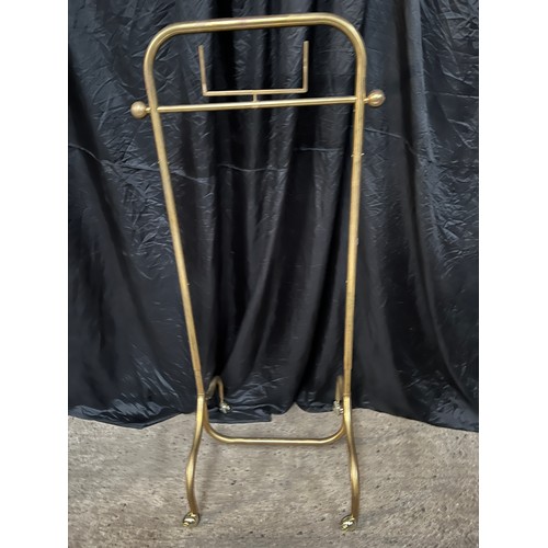 111 - ornate heavy brass clothes rail on braked wheels 29’ long x 25” ,adjustable height  62” high extends... 