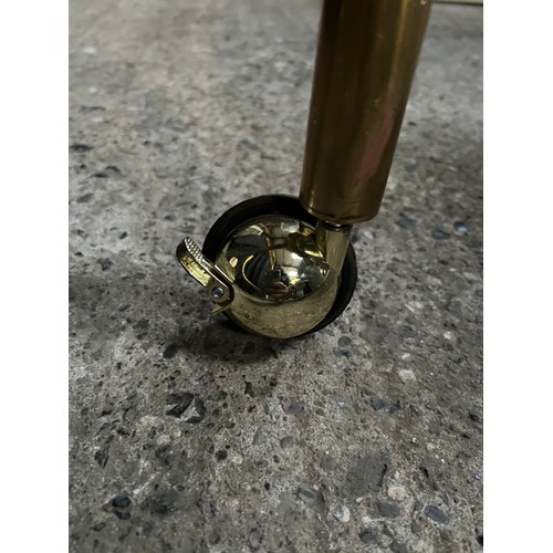 111 - ornate heavy brass clothes rail on braked wheels 29’ long x 25” ,adjustable height  62” high extends... 