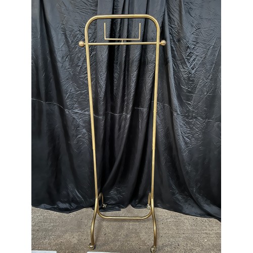 121 - ornate heavy brass clothes rail on braked wheels 29’ long x 25” ,adjustable height  62” high extends... 