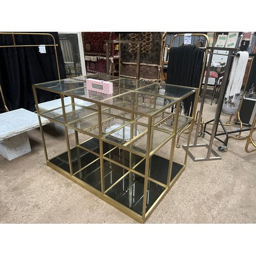 131 - ornate display unit 58” x 39” , 41” high , brass with heavy duty glass
 ( TED BAKER London clothes d... 