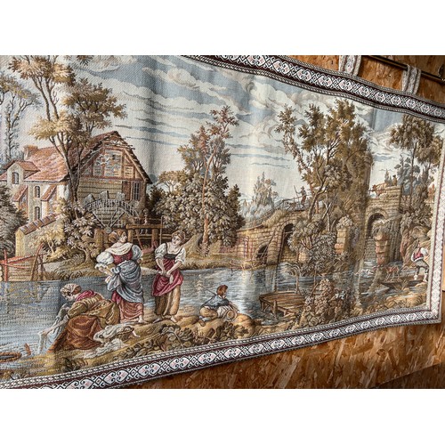 5 - Ornate large tapestry on brass rail