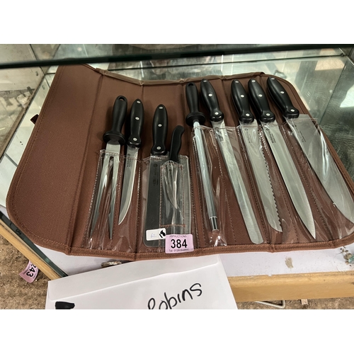 384 - new kitchen knife set in roll case h62