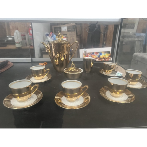 185 - ornate gold coloured coffee set