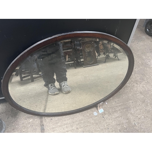 186 - wood framed oval mirror