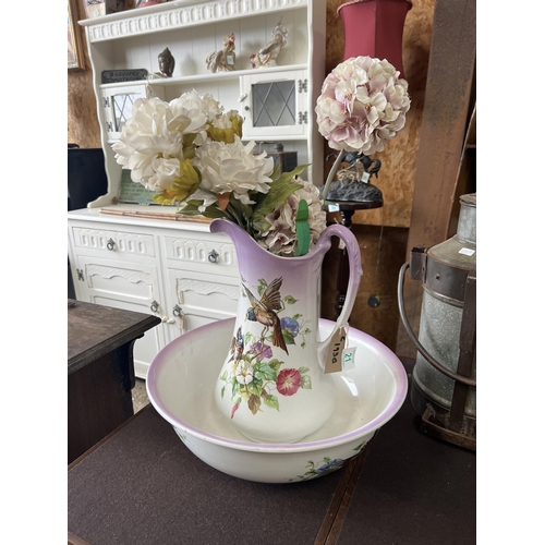 21 - wash jug and bowl decorated with flowers & bird    with faux flowers ,
A/F hair line cracks to bowl