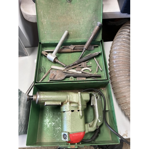 238 - Vintage hammer drill in metal case with tooling