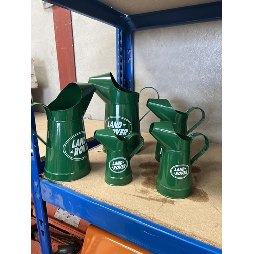 338 - X4 Land Rover oil jugs in ascending volumes