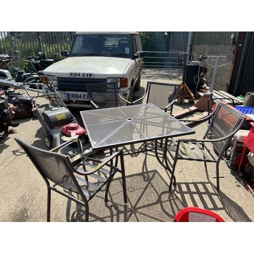 563 - Metal garden table and 4 chairs