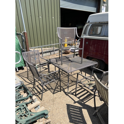 593 - Metal garden table and 4 chairs...