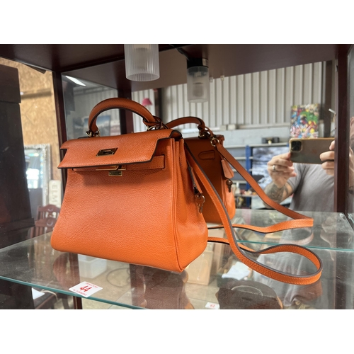 44 - burnt orange colour Ladies Hand bag