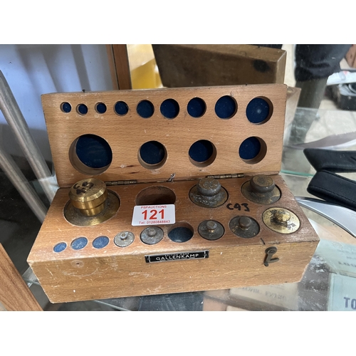 121 - brass weight in wood case incomplete set