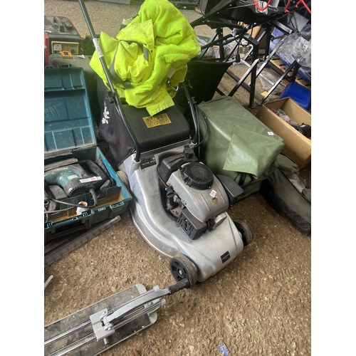 378 - Petrol mower plus yellow jacket